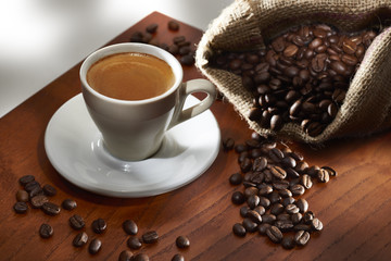 Cup of Coffee and Burlap Bag with Coffee