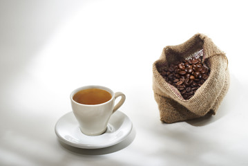 Cup of Coffee and Burlap Bag with Coffee