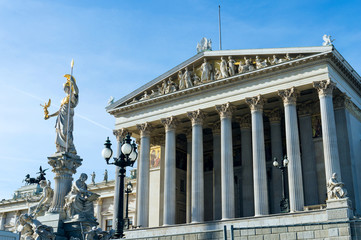 Fototapeta na wymiar Austrian parliament building with Athena statue on the front in Vienna