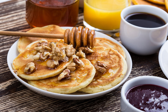 Mother's day brunch with  delicious pancakes with honey and nuts