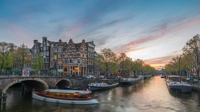 Amsterdam city skyline sunset timelapse at canal waterfront, Amsterdam, Netherlands 4K Time Lapse
