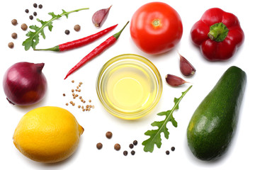 healthy food. mix of avocado, lemon, tomato, red onion, garlic, sweet bell pepper and rucola leaves isolated on white background top view