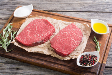 Raw beef steak with rosemary