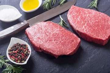 Raw beef steak with rosemary