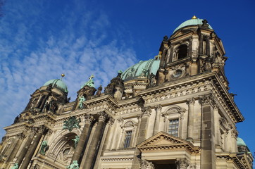 Fototapeta na wymiar Berliner Dom - cathedral in Berlin. Rich decorations and decorative sculptures of the facade of one of the most famous churches in Germany, the historic cathedral standing on the Museum Island.