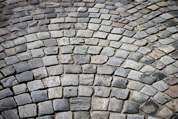 Old cobblestone road in city of Europe
