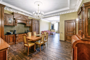 The kitchen is solid wood in a classic style in a modern house.