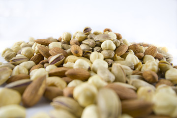 Several Nuts Isolated on White Background in Depth of Field