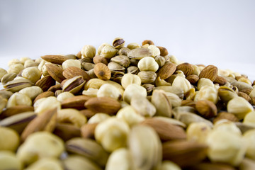 Several Nuts Isolated on White Background in Depth of Field