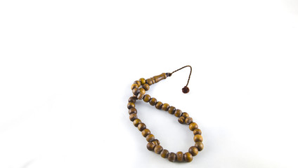 Naklejka premium A Brown Rosary on White Background ısolated