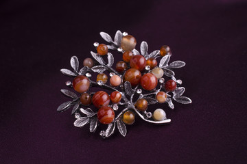 brooch tree with gems isolated on silk