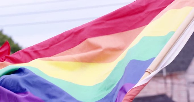 Rainbow flag - gay pride flying briskly in wind