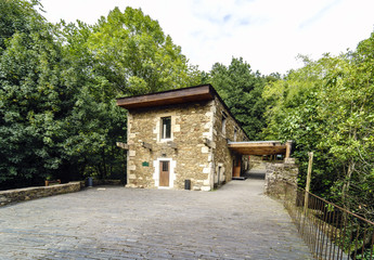 Restored stone building of the Monastery of  Caaveiro  dating back to the 10th century and welcoming hermits of the area, in Galicia, Spain.