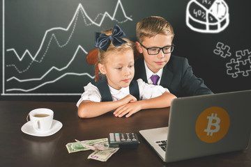 Smart children buying bitcoin cryptocurency