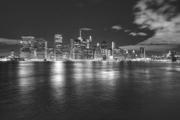 Black and white Manhattan panorama at night, New York City, USA.