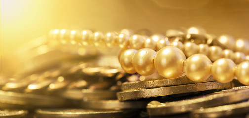 Pearls and gold coins - web banner of wealth, luxury concept