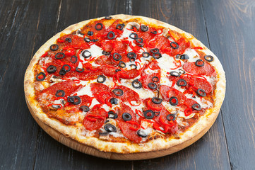 fresh and delicious Italian pizza on a wooden table