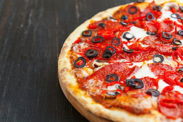 fresh and delicious Italian pizza on a wooden table