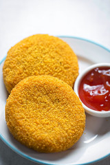 Breaded mozzarella with tomato dip