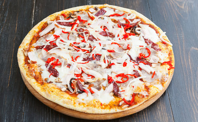 fresh and delicious Italian pizza on a wooden table