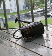 tipped over watering can