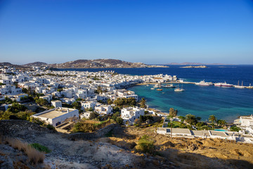 Fototapeta na wymiar Mykonos island aerial panoramic view at sunny day. Mykonos is a island, part of the Cyclades in Greece with old architecture one the foreground