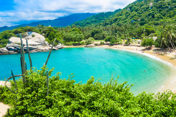 Aerial view of unidentified people enjoying the water of beach at Cabo San Juan,Tayrona Natural...