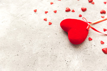 Valentine day. Red heart pendant on a background. Valentine's Day. Heart pendant. Space for text. Eighth of March. International Women's Day.