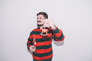 funny boy holds christmas decoration