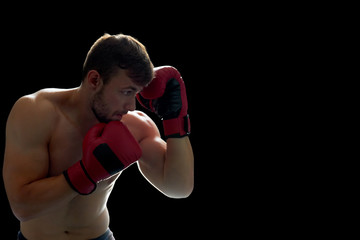 Young boxing fighter on black. Developing agility and accuracy, blow workout. Lifestyle and combat...