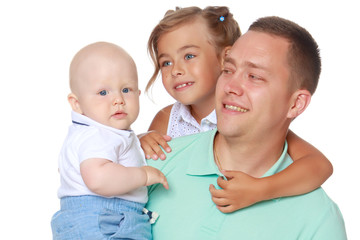 Happy dad with young children.