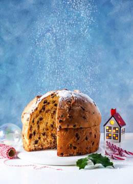 Italian festive bread panetton with chocolate on the table decorated for Christmas.  New Year's traditional dessert