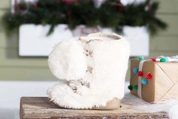 Winter decoration with white snow boot and present box