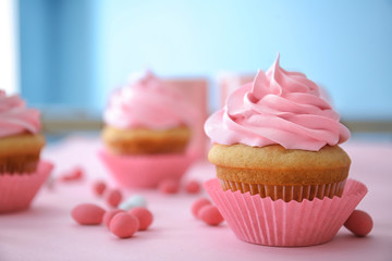 Delicious cupcake on table