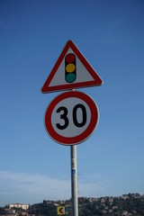 Traffic lights and 30 speed limit signs