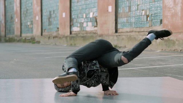 Breakdancer dancing on the street. 4K