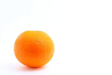 One mandarin orange shot over white background