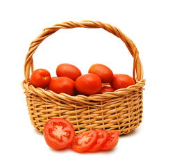 Fresh tomatoes and slice  in basket isolated on white