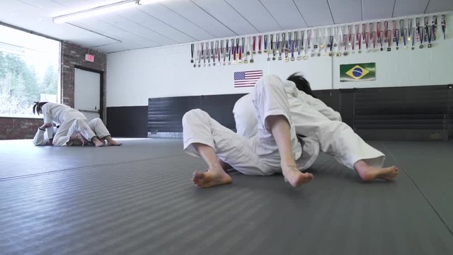 Young women practicing Jiu-jitsu