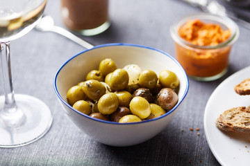Green olives in bowl.