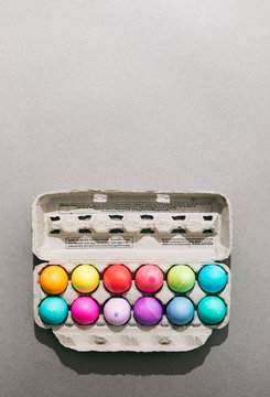Easter Eggs In Carton On Grey Background