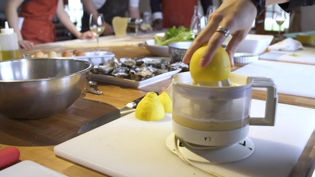 Chef using a lemon squeezer machine