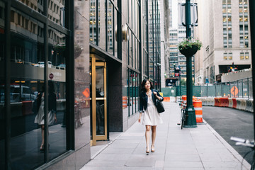 Woman walking down street