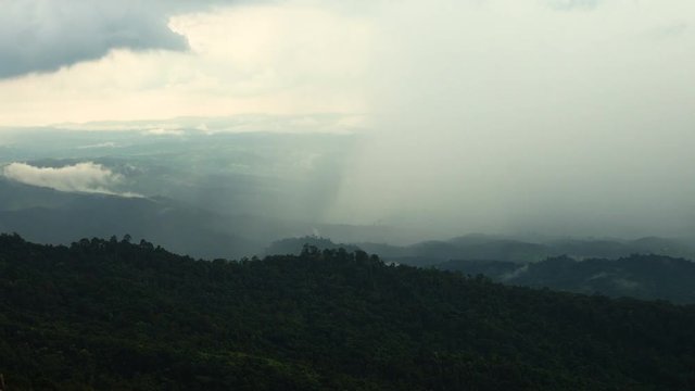 The rain cloud raining over the tropical mountain at Phu Hin Rong Kla National Park , Thailand