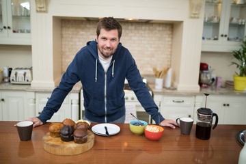 Man preparing muffins in the kitchen