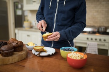 Man preparing muffins in the kitchen