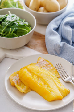 Ingredients for making a healthy smoked haddock dish.