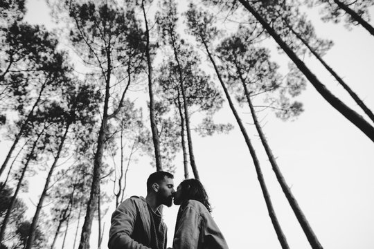 lovely interracial couple in the forest