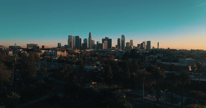 Cinematic Urban Aerial Drone Footage Of Downtown Los Angeles With City Skyline, Freeway And Traffic Below.