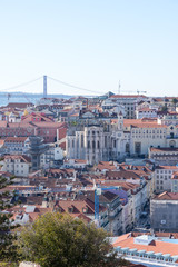 Fototapeta na wymiar Cidade Baixa, Tejo River and 25 de Abril Bridge, in the city of Lisbon, Portugal.